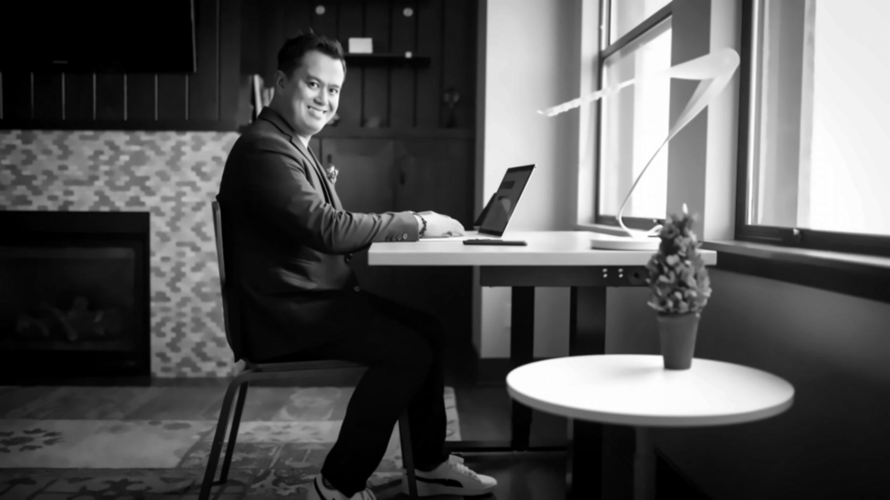 Family discussing finances with paperwork spread on dining table